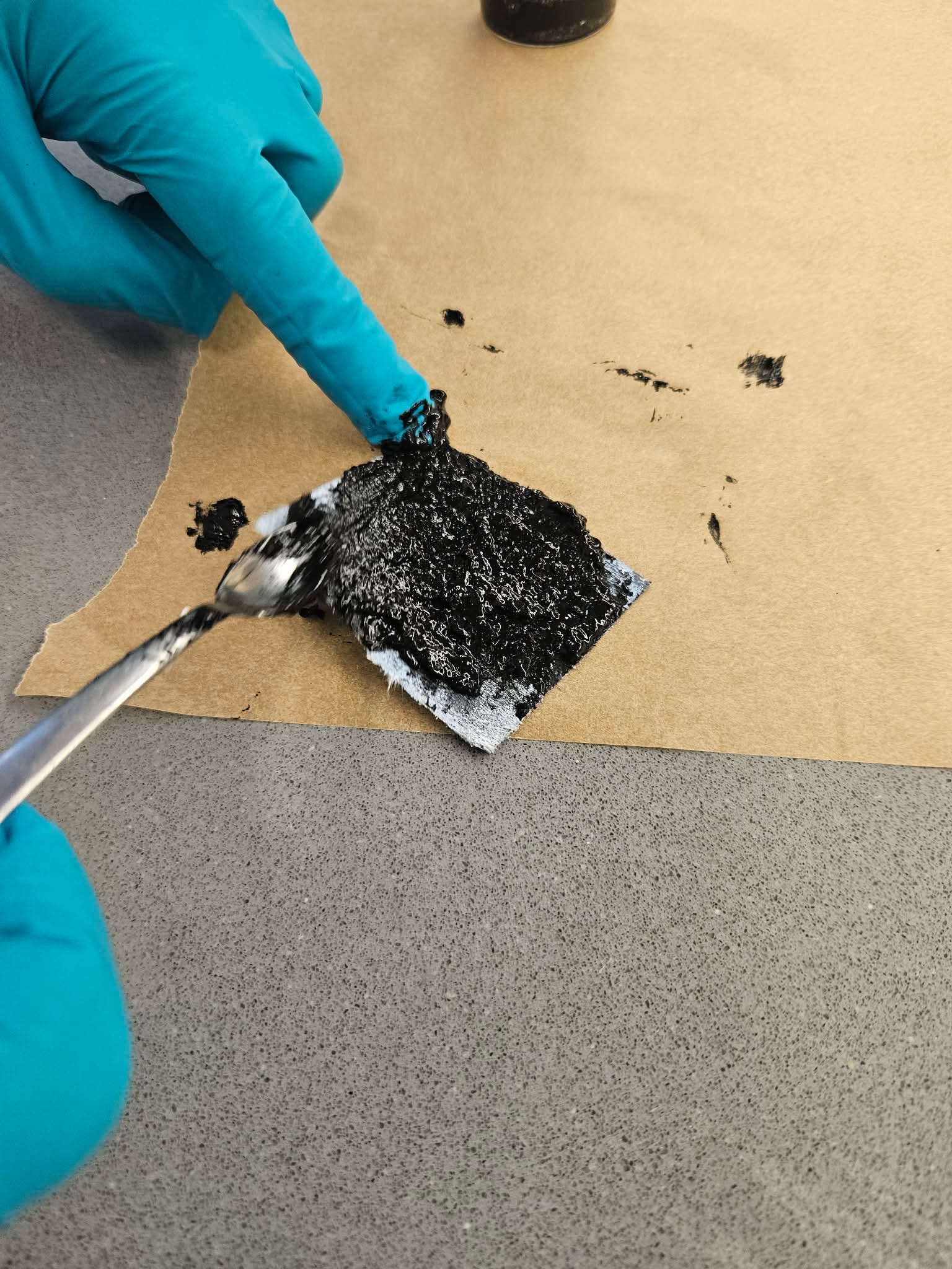 Cathode coating material being applied in the lab