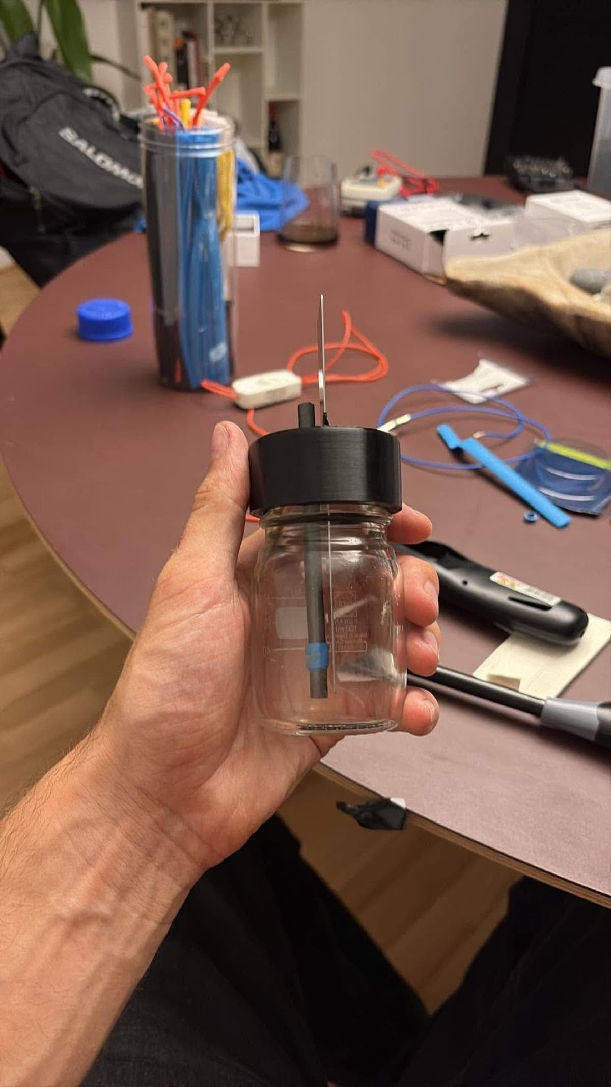 The MudBottle reactor, still held by hand, before it became a clean render.
